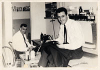 Vincenzo Paxia (right) in the tailor shop at Maury Robinson's, Trenton, NJ, 1963